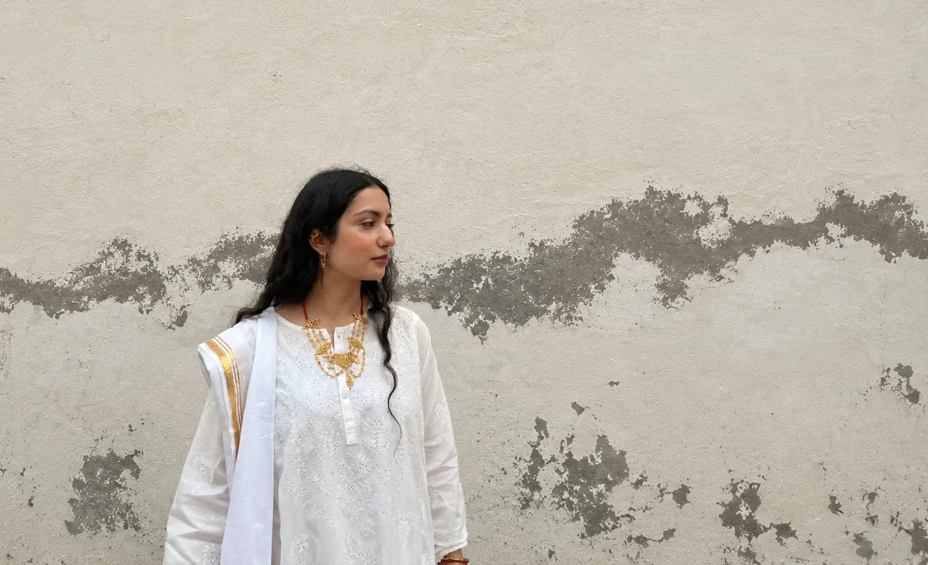 A girl wearing white oni handmade dress